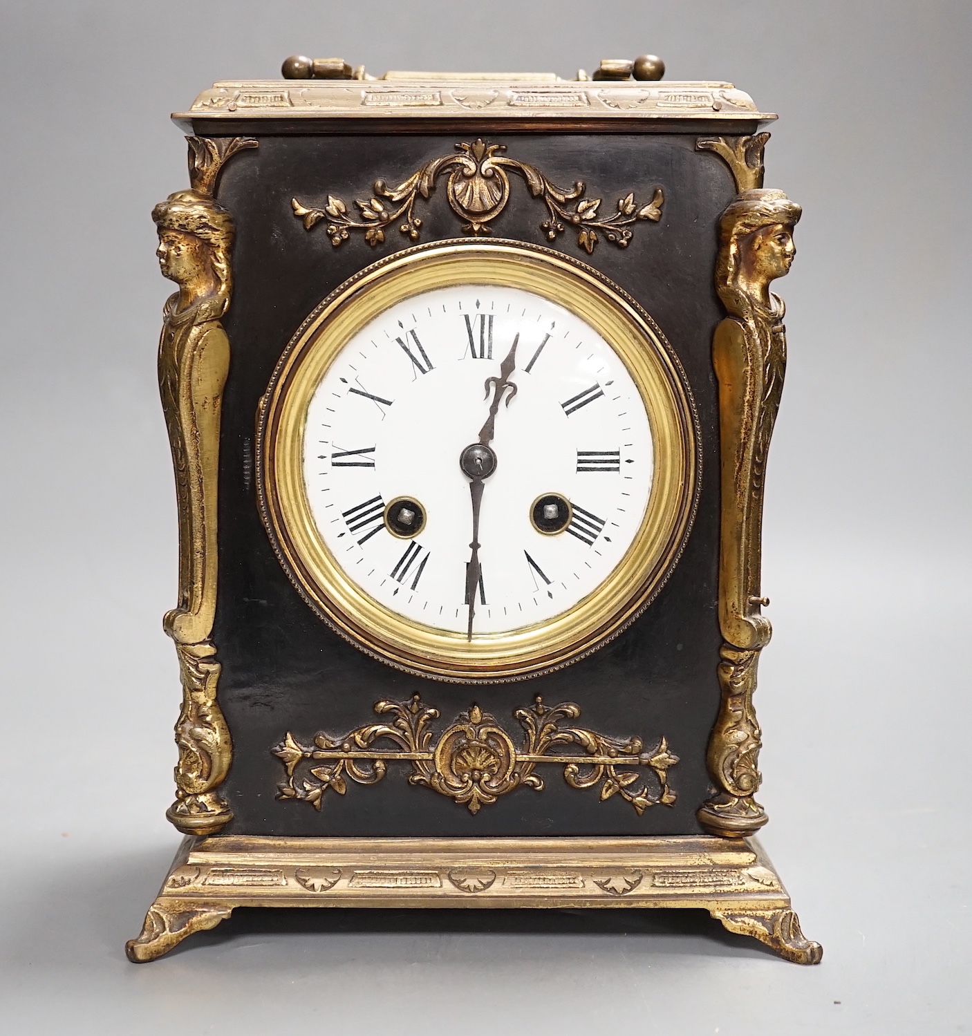 A 19th century brass and ebonised mantel clock